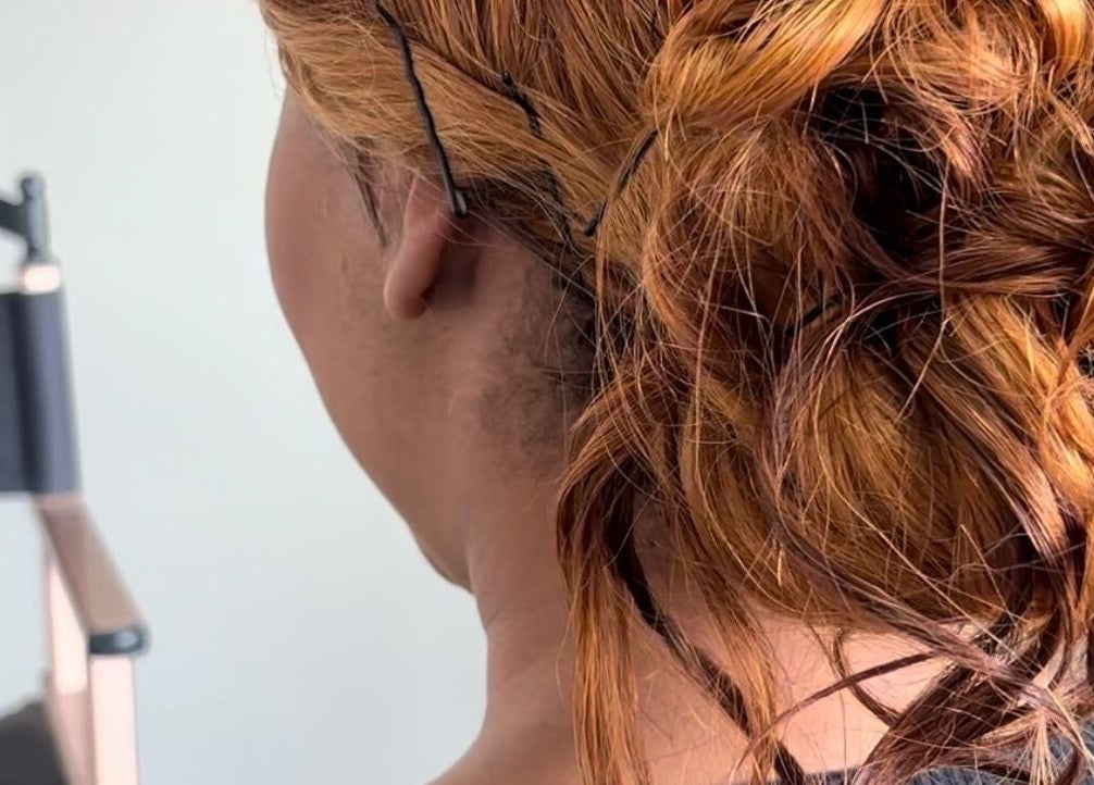 Elegant updo hairstyle at Ubuhle Bebhudango Beauty Studios in Ga-nala, Mpumalanga, ZA.