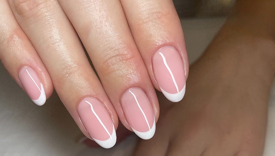 French manicure nail art at No10 Hair and Beauty, Duffield, England, GB showcasing sleek elegance.