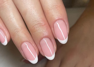 French manicure nail art at No10 Hair and Beauty, Duffield, England, GB showcasing sleek elegance.