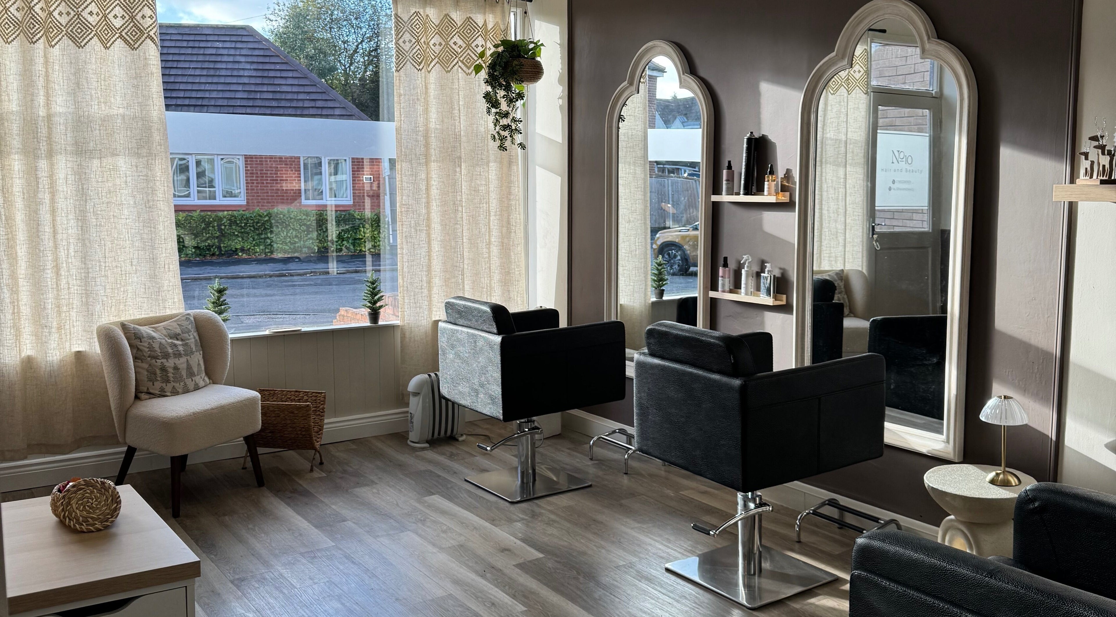Modern interior of No10 Hair and Beauty in Duffield, England, GB, with elegant decor and stylish salon chairs.