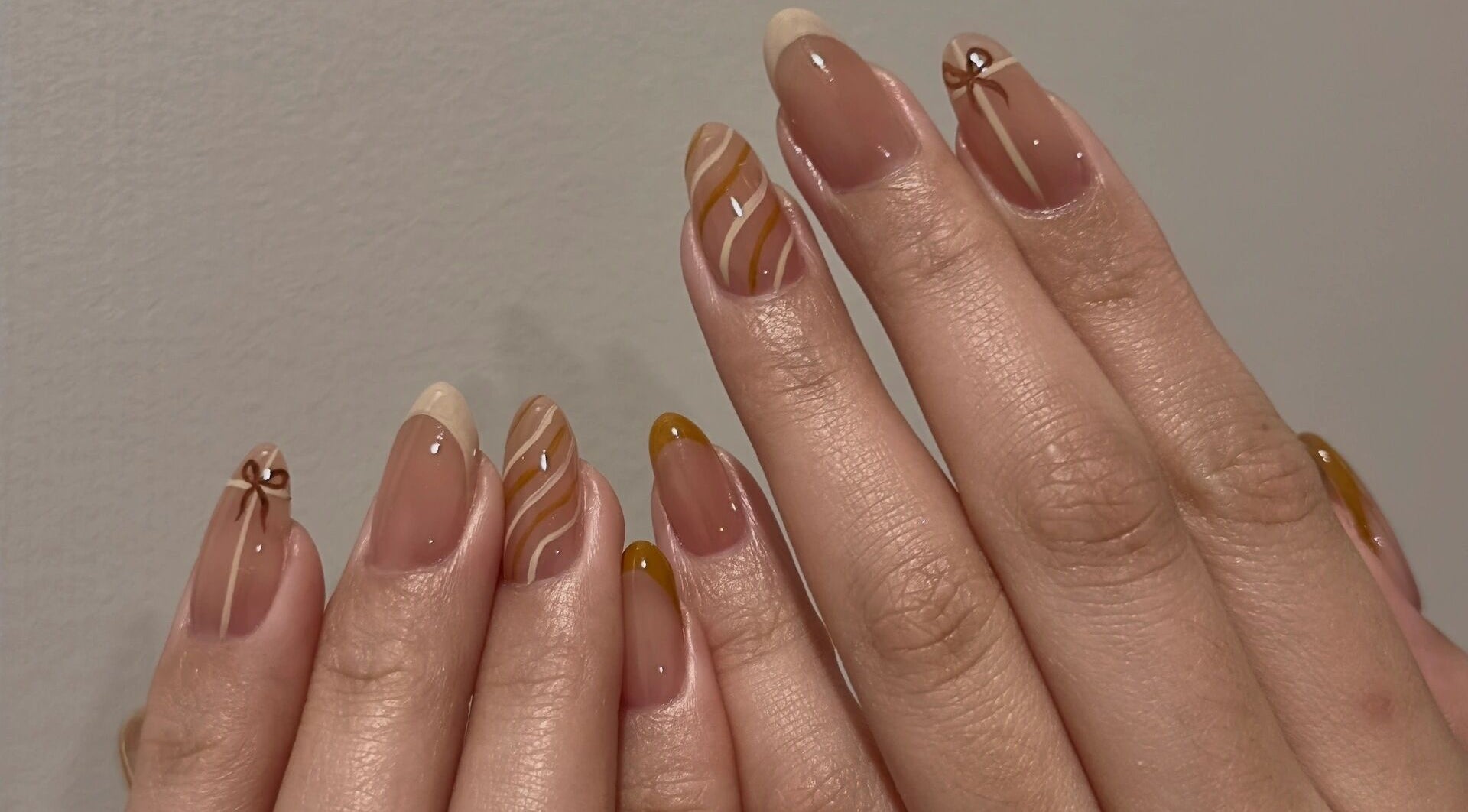 Nail art with swirls at Summer-Nails, Melbourne, Victoria, AU. Featuring brown and beige designs.