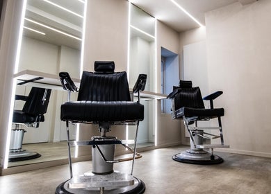 Modern barber chairs at Luchmun Studios Ware, Ware, England, GB, offering stylish grooming services.