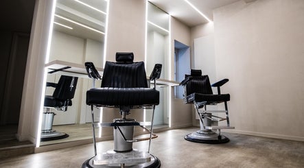 Modern barber chairs at Luchmun Studios Ware, Ware, England, GB, offering stylish grooming services.
