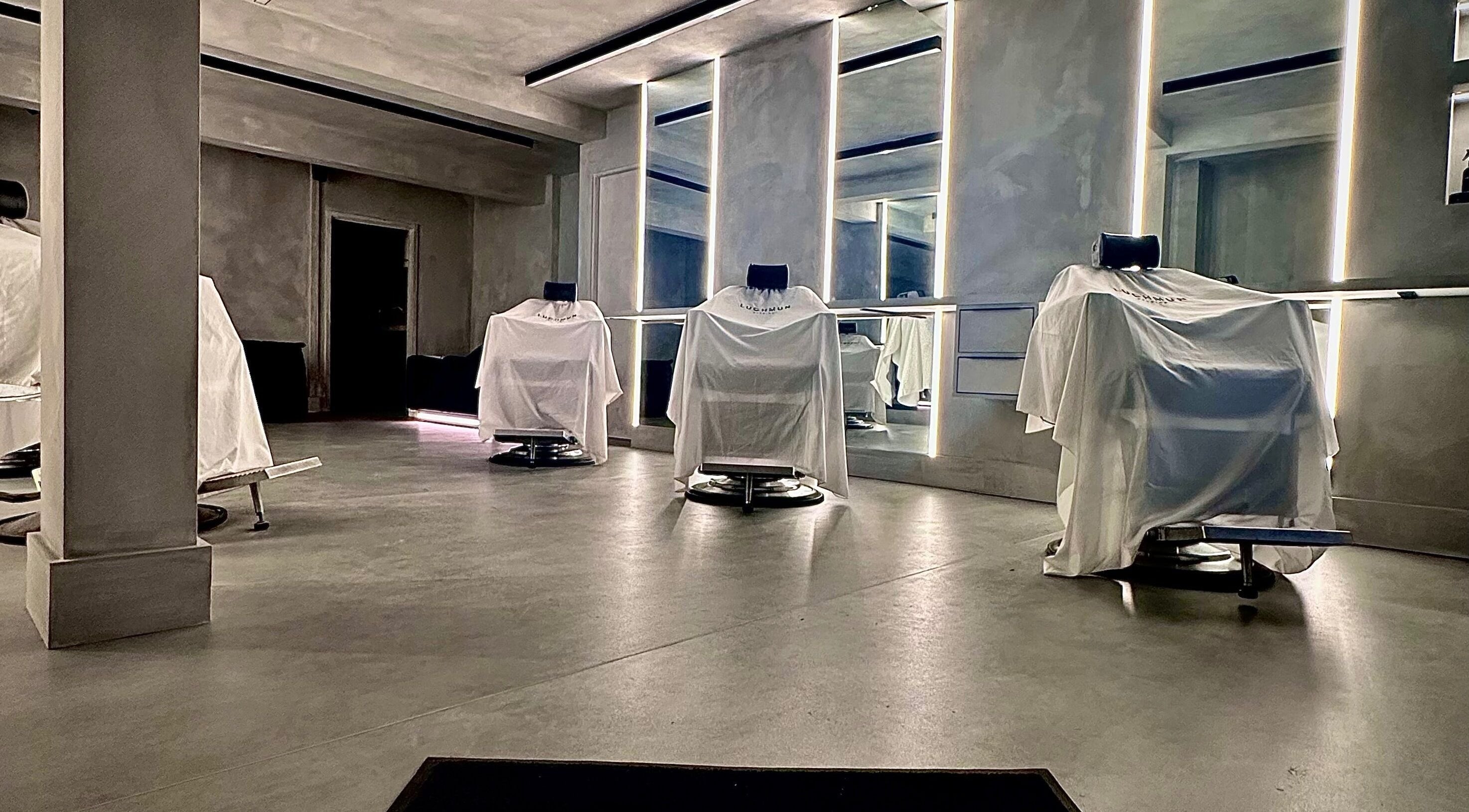 Luxurious salon chairs at Luchmun Studios Ware, Ware, England, GB. Brightly lit, modern aesthetic.