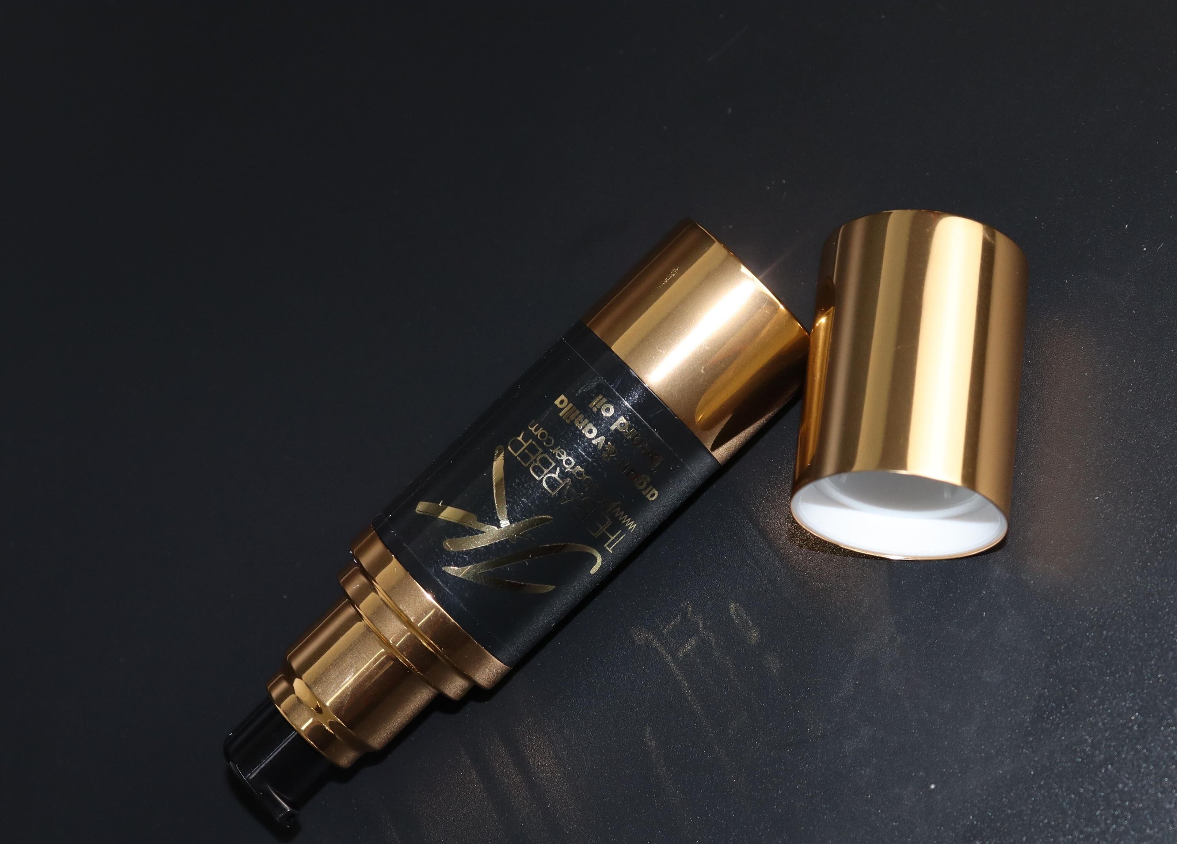 Luxurious gold cosmetic bottle at Jk The Barber Studios Limited in Edgware, England, GB.