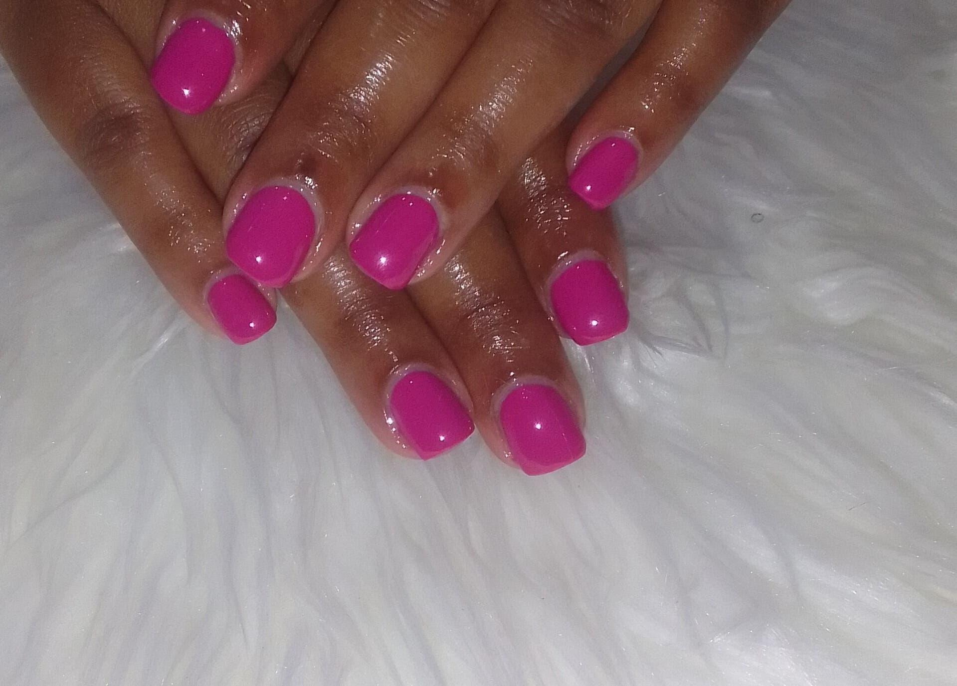 Bright pink manicure at Sharlon Beuti Bar, Cape Town, Western Cape, ZA showcasing elegant hand care.