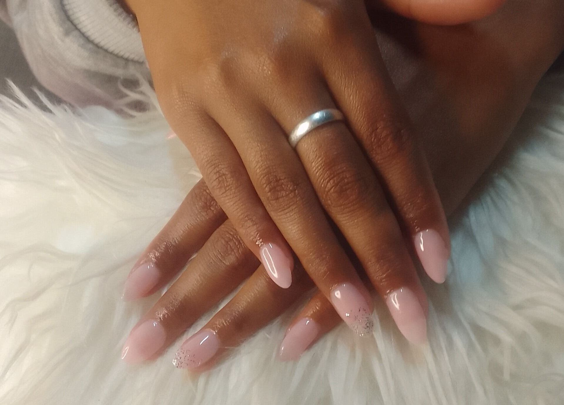 Elegant pink manicure at Sharlon Beuti Bar in Cape Town, Western Cape, ZA, showcasing beautifully polished nails.