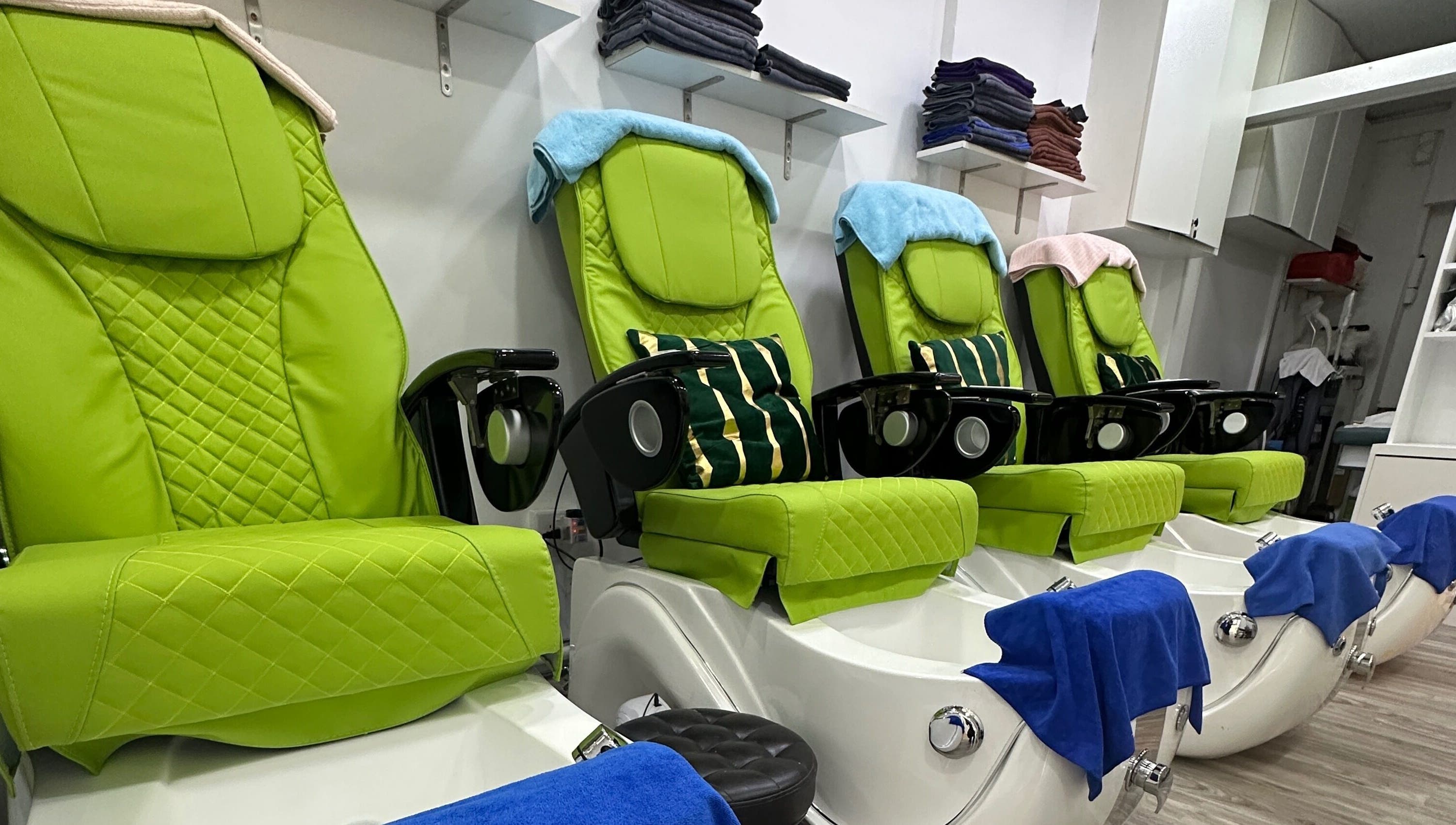 Luxurious pedicure chairs at The Queenz, Singapore, SG, offering ultimate comfort and relaxation.