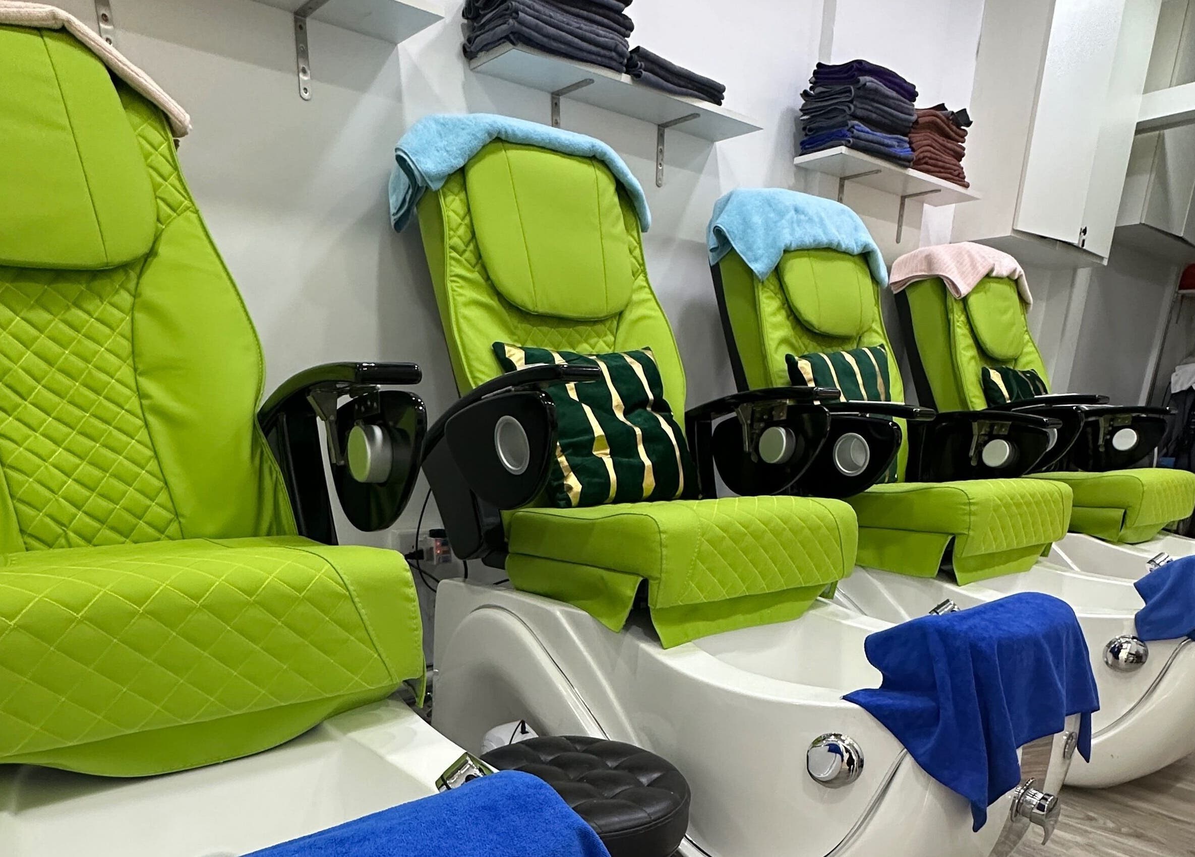 Luxurious pedicure chairs at The Queenz, Singapore, SG, offering ultimate comfort and relaxation.