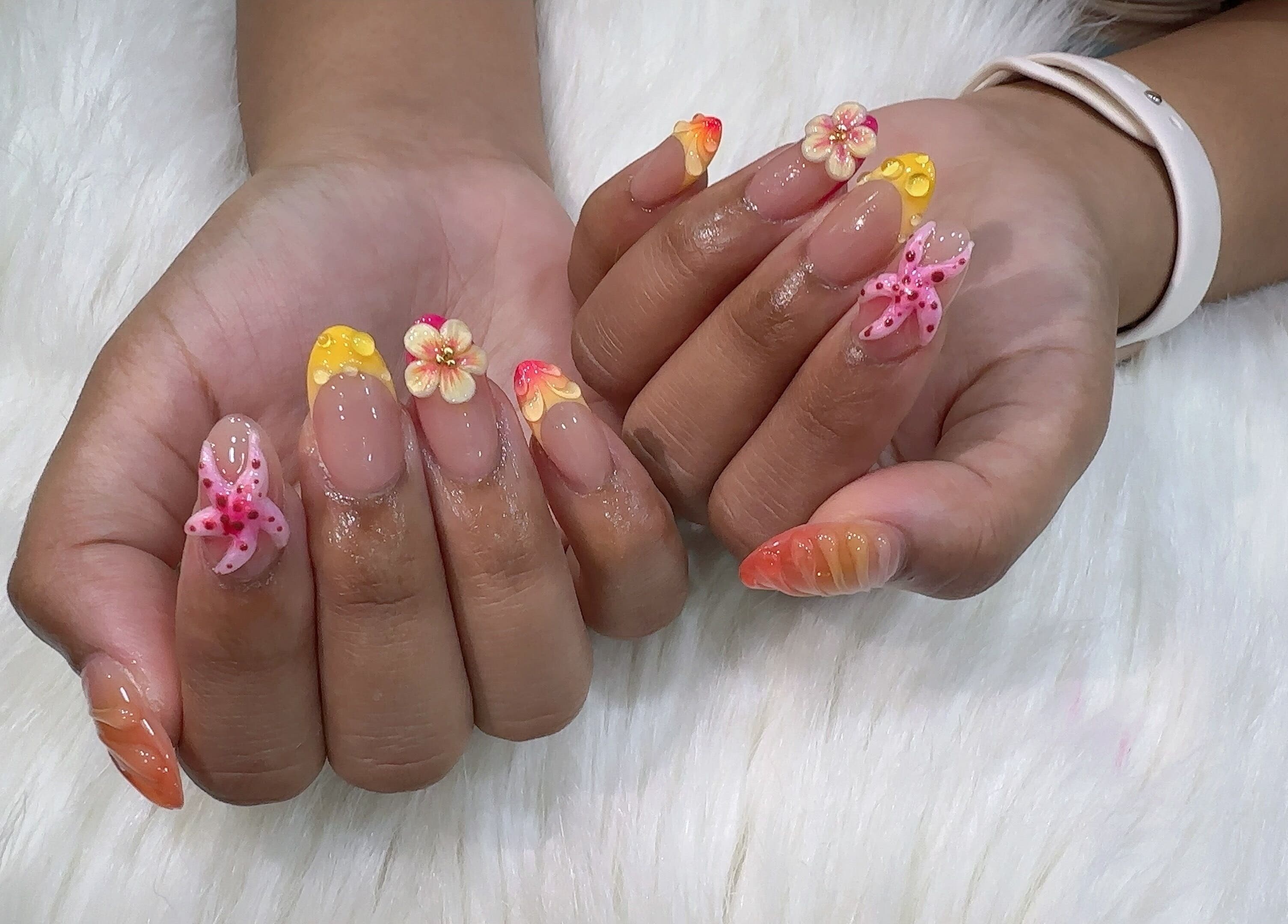 Beautiful floral nail art at The Queenz, Singapore, SG. Vibrant 3D designs with intricate detail.