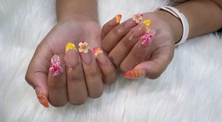 Beautiful floral nail art at The Queenz, Singapore, SG. Vibrant 3D designs with intricate detail.