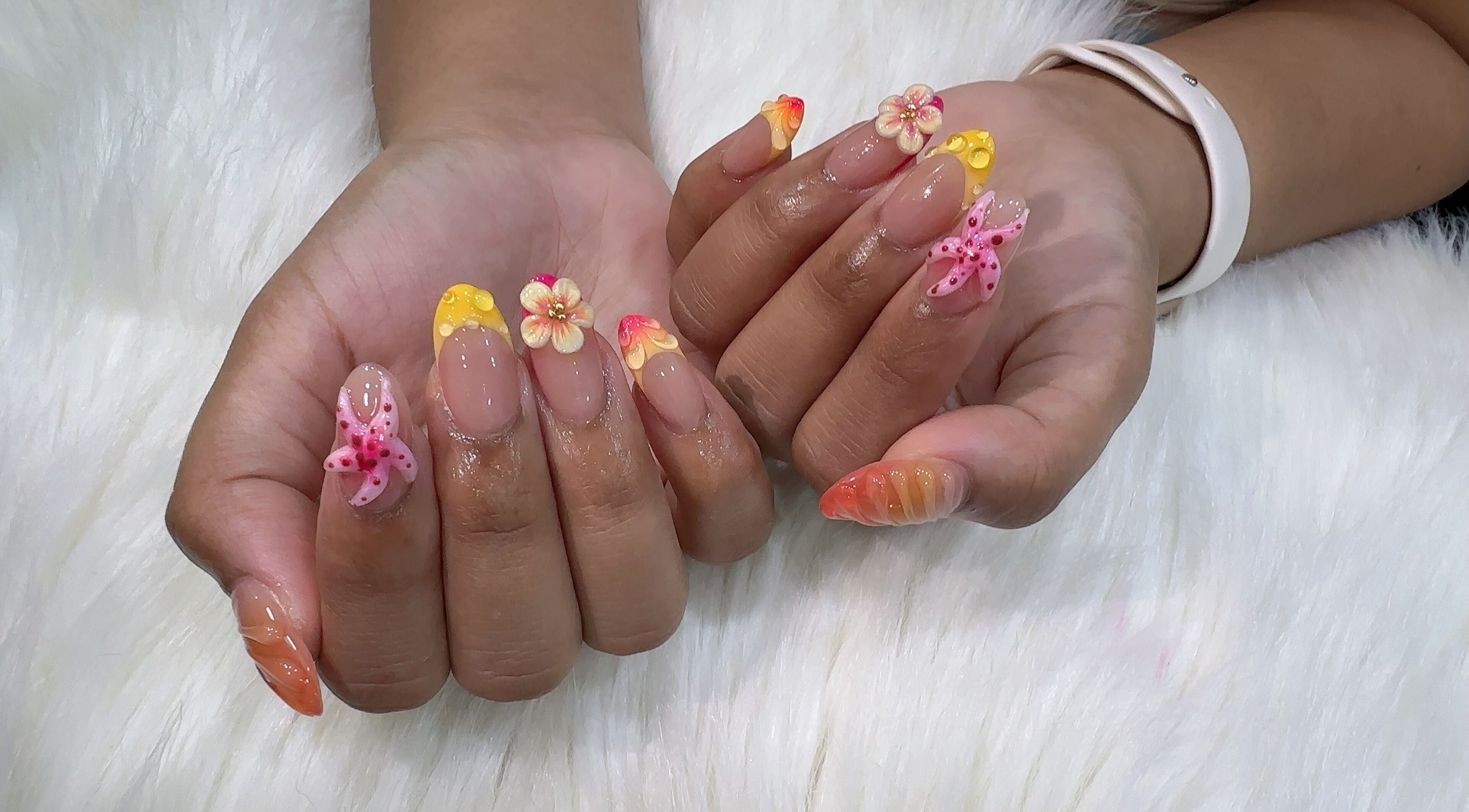 Beautiful floral nail art at The Queenz, Singapore, SG. Vibrant 3D designs with intricate detail.