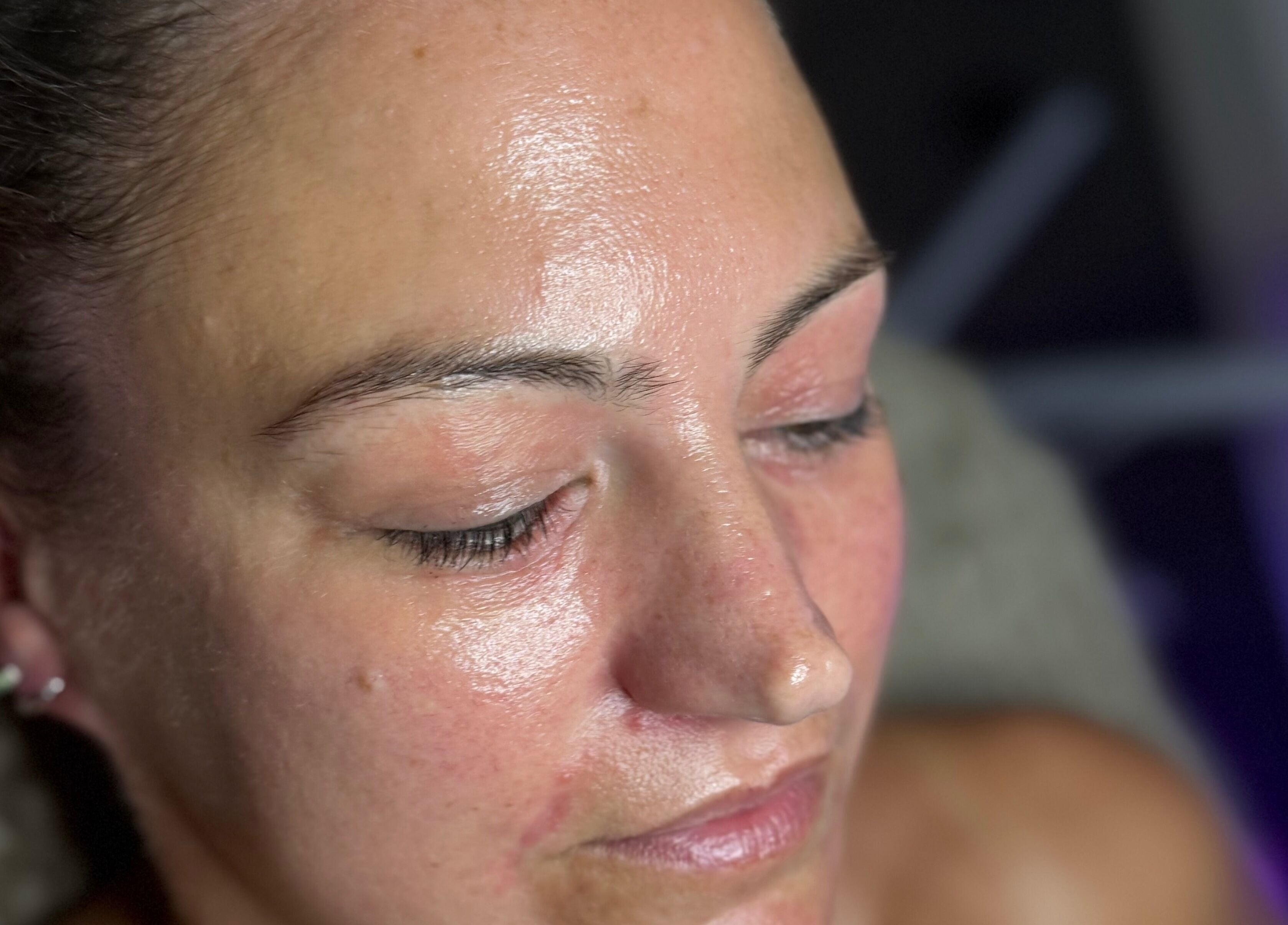 Close-up of a relaxed woman after facial treatment at The Lash Room, Ayr, Scotland, GB. Skin appears smooth and rejuvenated.