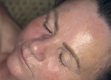 Close-up of a relaxed face with glowing skin after a treatment at The Lash Room, Ayr, Scotland, GB.