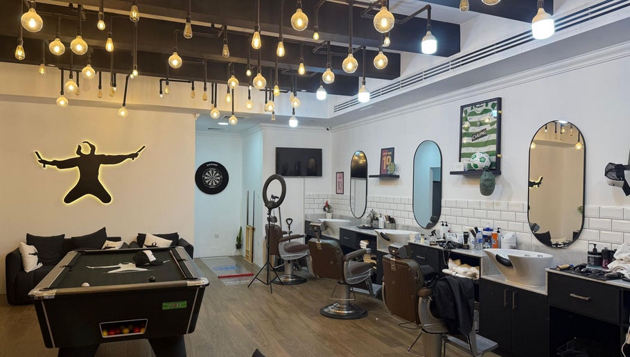 Modern barber interior at Sweeney Todds Barbers, Arjan, Dubai, AE with stylish lighting and decor.