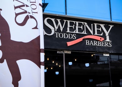 Sweeney Todds Barbers storefront in Arjan, Dubai, AE with unique signage and logo.
