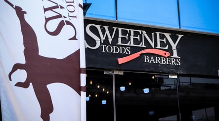 Sweeney Todds Barbers storefront in Arjan, Dubai, AE with unique signage and logo.