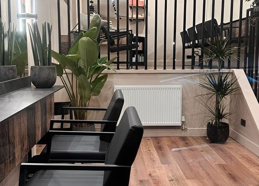 Chic interior of Render salon, Birmingham, England, GB with stylish seating and modern decor.
