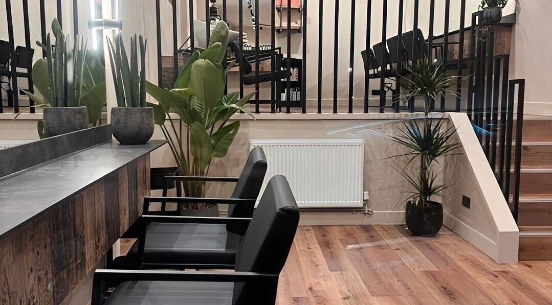 Chic interior of Render salon, Birmingham, England, GB with stylish seating and modern decor.