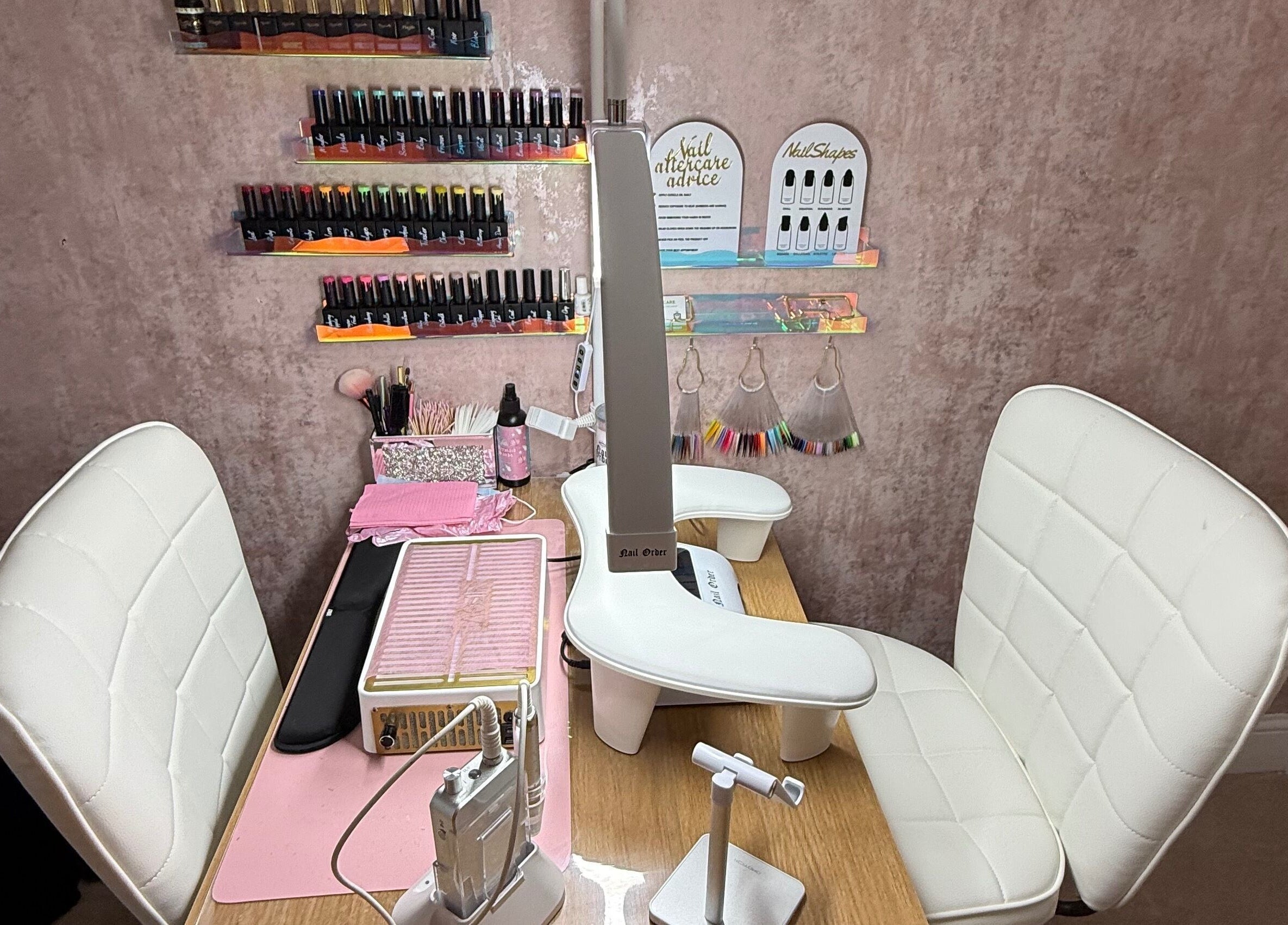 Nail station at Gemini Nails, Plymouth, England, GB featuring chairs and manicure tools.