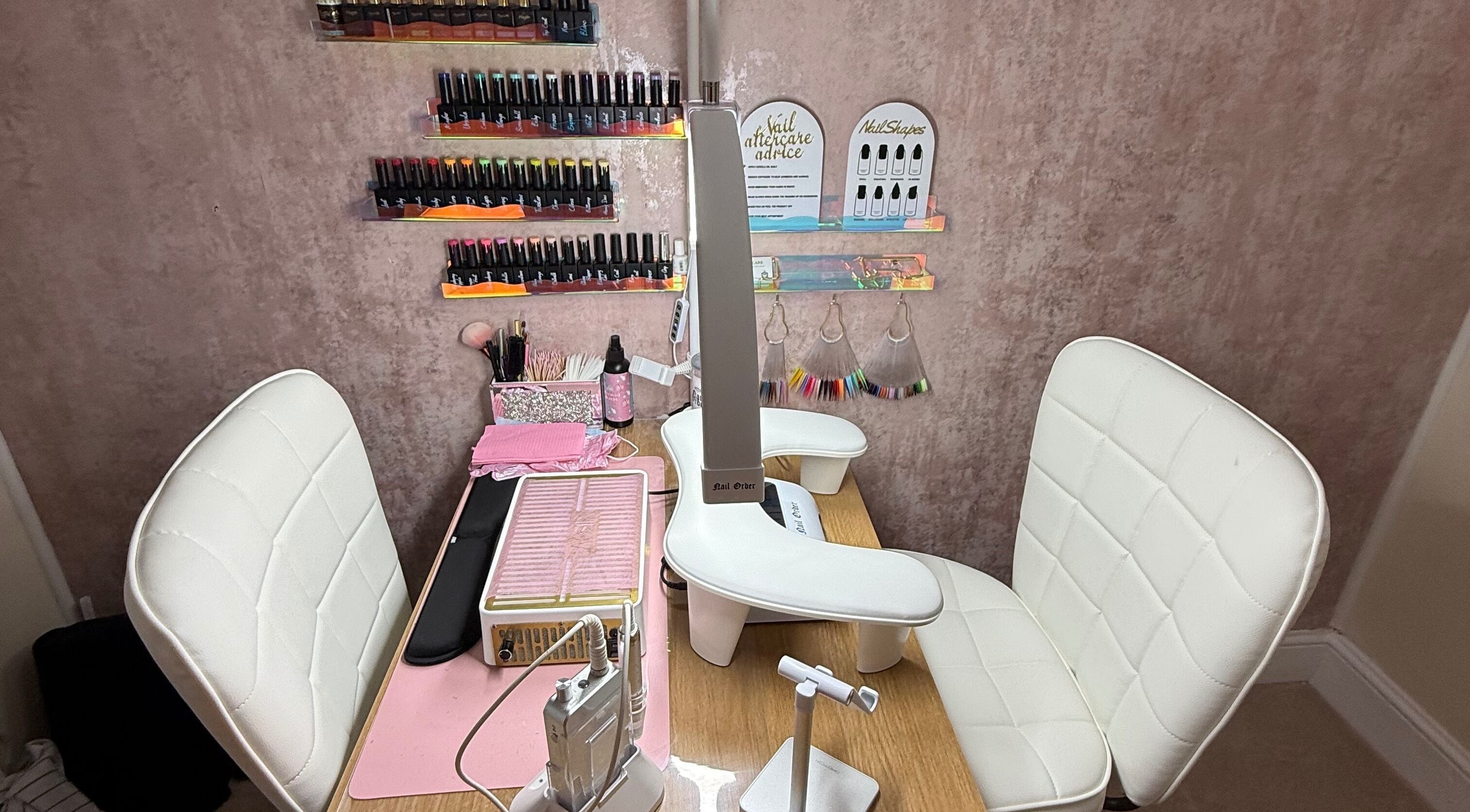 Nail station at Gemini Nails, Plymouth, England, GB featuring chairs and manicure tools.