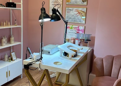 Elegant nail station at PAŁKA | Witney Beauty & Aesthetics, Witney, England, GB. Features certificates, products, and plush seating.