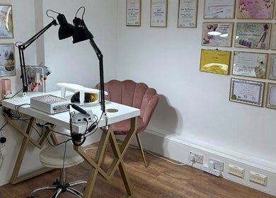 Elegant beauty workspace at PAŁKA | Witney Beauty & Aesthetics, Witney, England, GB with a plush pink chair.