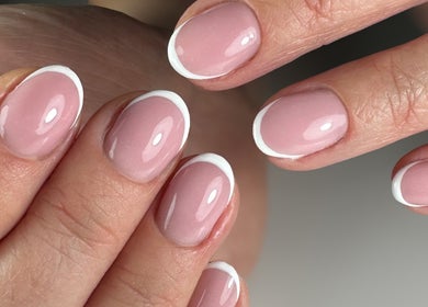 Elegant French manicure at PAŁKA | Witney Beauty & Aesthetics in Witney, England, GB. Beautiful pink and white nails.