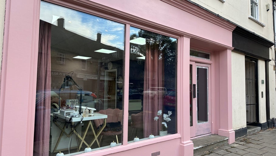 Chic pink storefront of Jolanta PAŁKA | Witney Beauty & Aesthetics in Witney, England, GB, showcasing stylish interior.
