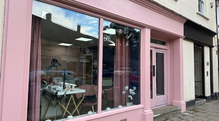 Chic pink storefront of Jolanta PAŁKA | Witney Beauty & Aesthetics in Witney, England, GB, showcasing stylish interior.