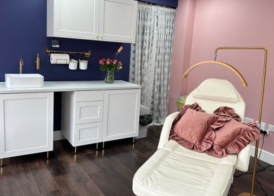 Elegant salon at Jolanta PAŁKA | Witney Beauty & Aesthetics, Witney, England, GB. Plush seating and modern decor.