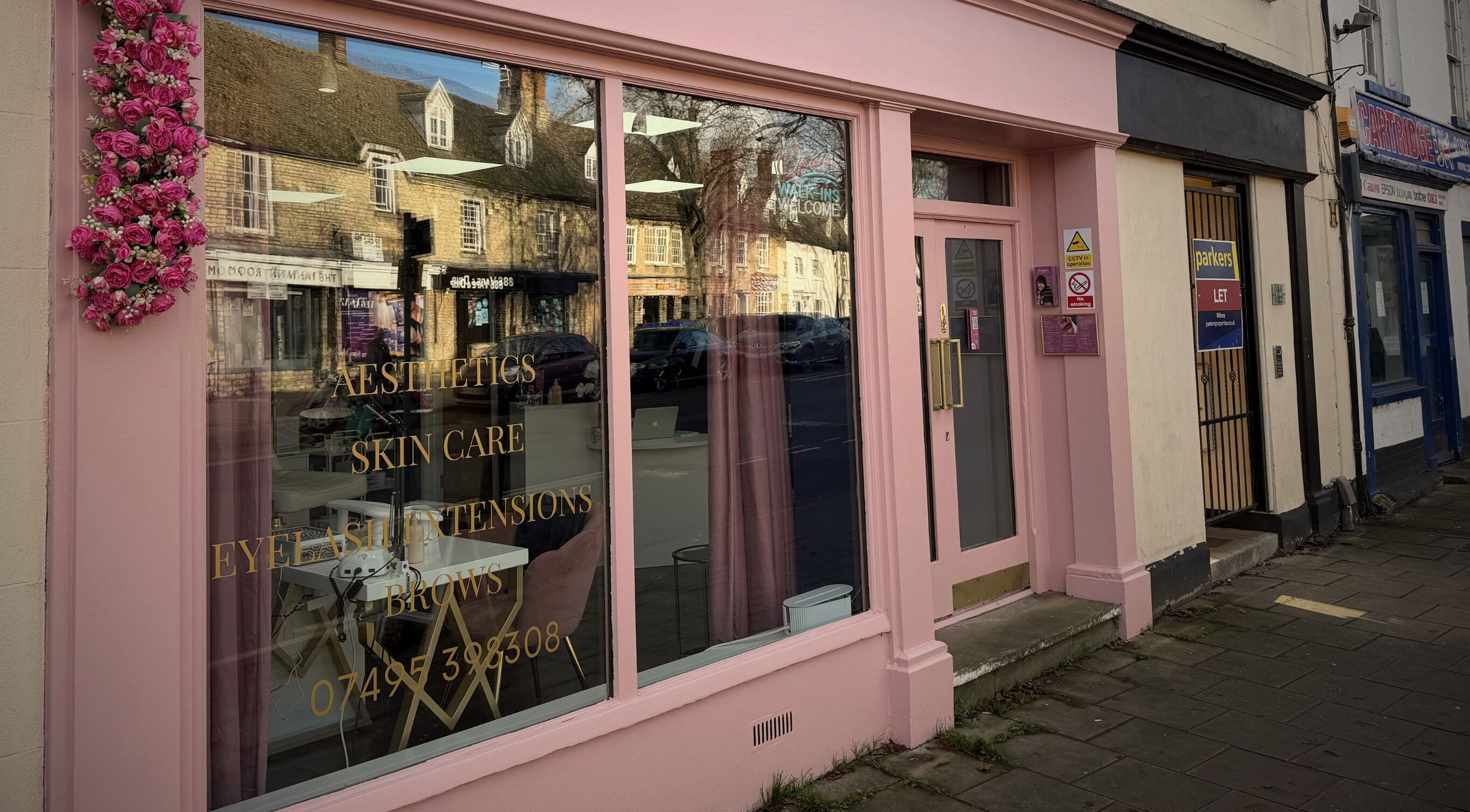 Jolanta Palka's pink storefront in Witney, England, GB showcasing skincare and cosmetics services.