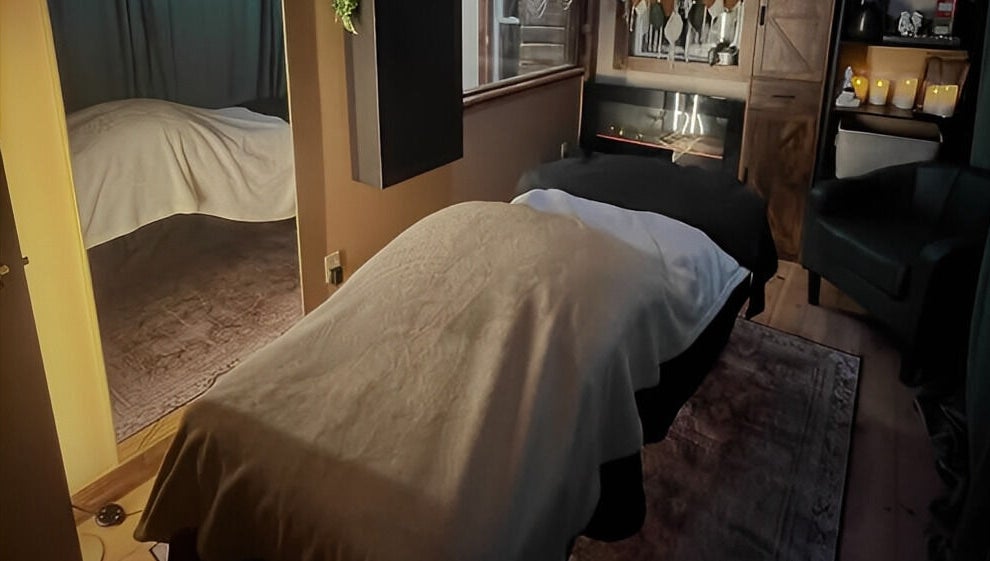 Cozy massage room at Connected LLC, Readfield, Maine, US, featuring a welcoming atmosphere and soft lighting.
