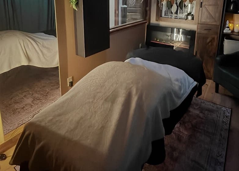 Cozy massage room at Connected LLC, Readfield, Maine, US, featuring a welcoming atmosphere and soft lighting.