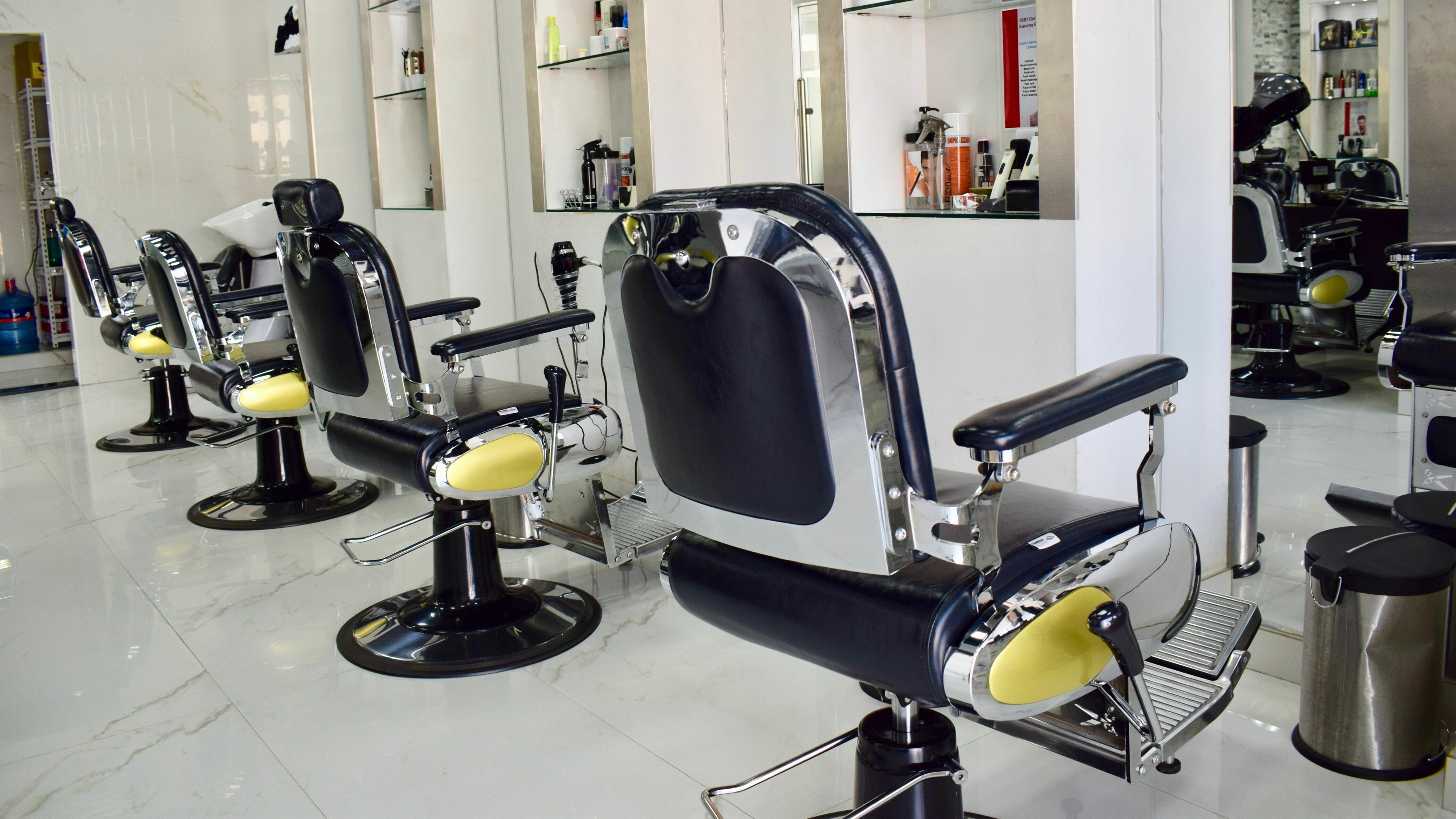 Modern barber chairs at 1981 Gents Salon - Skycourts, Dubai, AE, reflecting a sleek and sophisticated style.