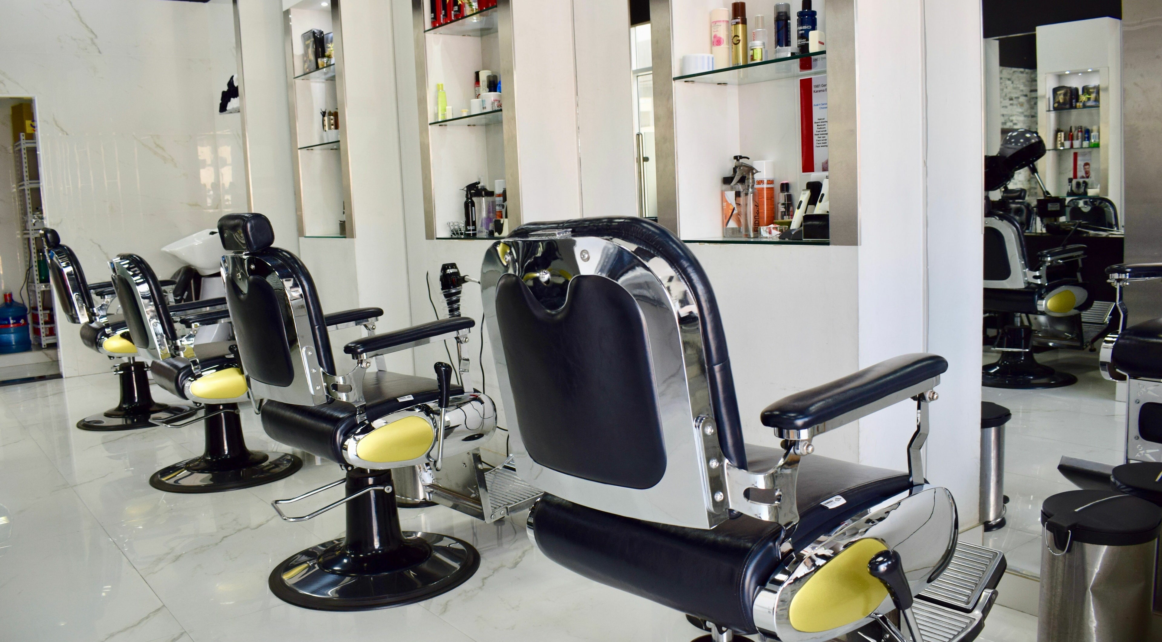 Interior of 1981 Gents Salon - Karama, Dubai, AE, showcasing sleek barber chairs and modern design.