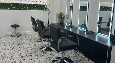 Modern styling chairs at Angel Hair & Lash Studio in Melbourne, Victoria, AU with sleek mirrors and floral decor.