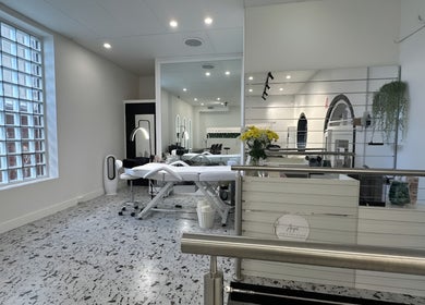 Modern interior of Angel Hair & Lash Studio, Melbourne, Victoria, AU with stylish decor and treatment bed.