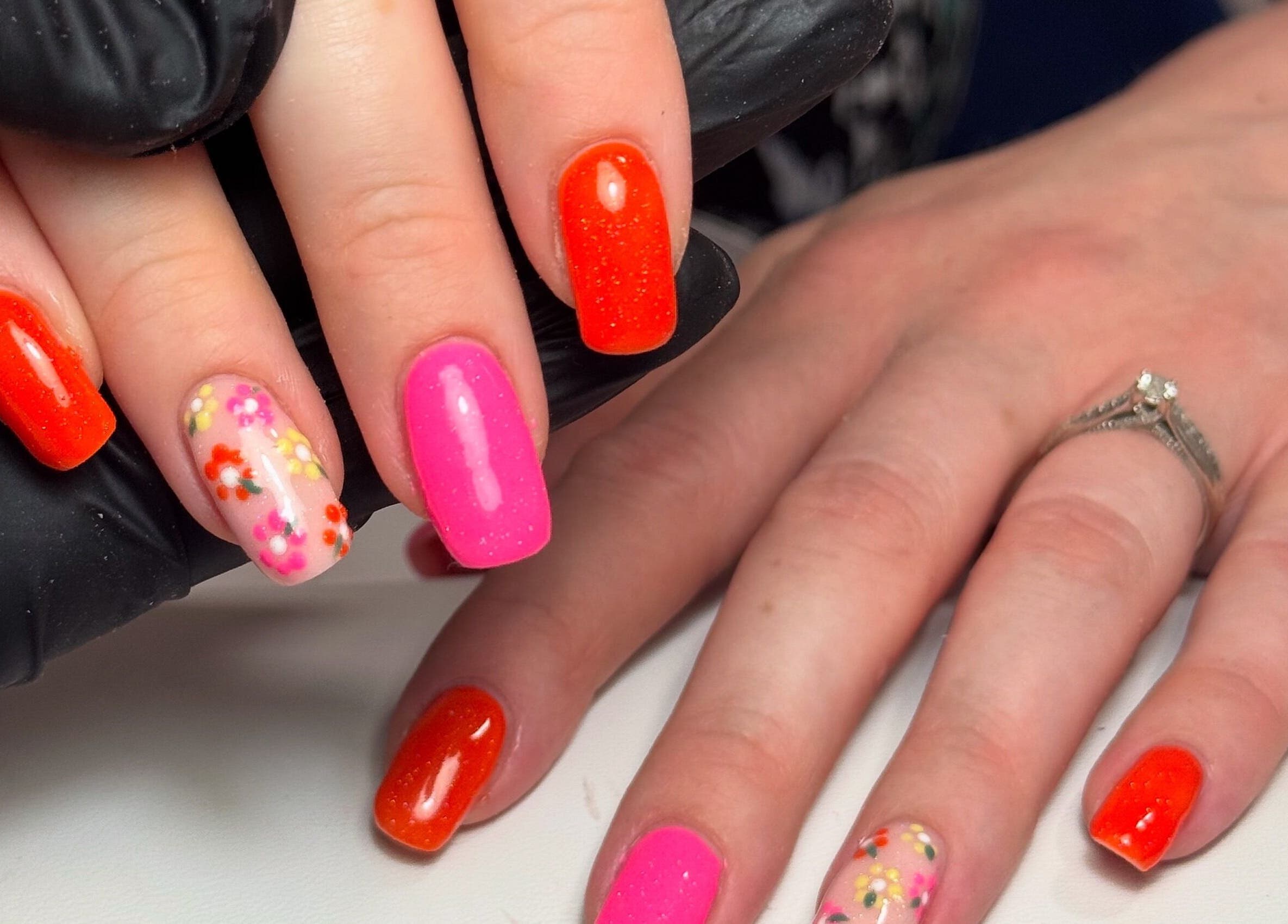 Colorful nail art with floral designs at Nails by Lulu, located in Fareham, England, GB.