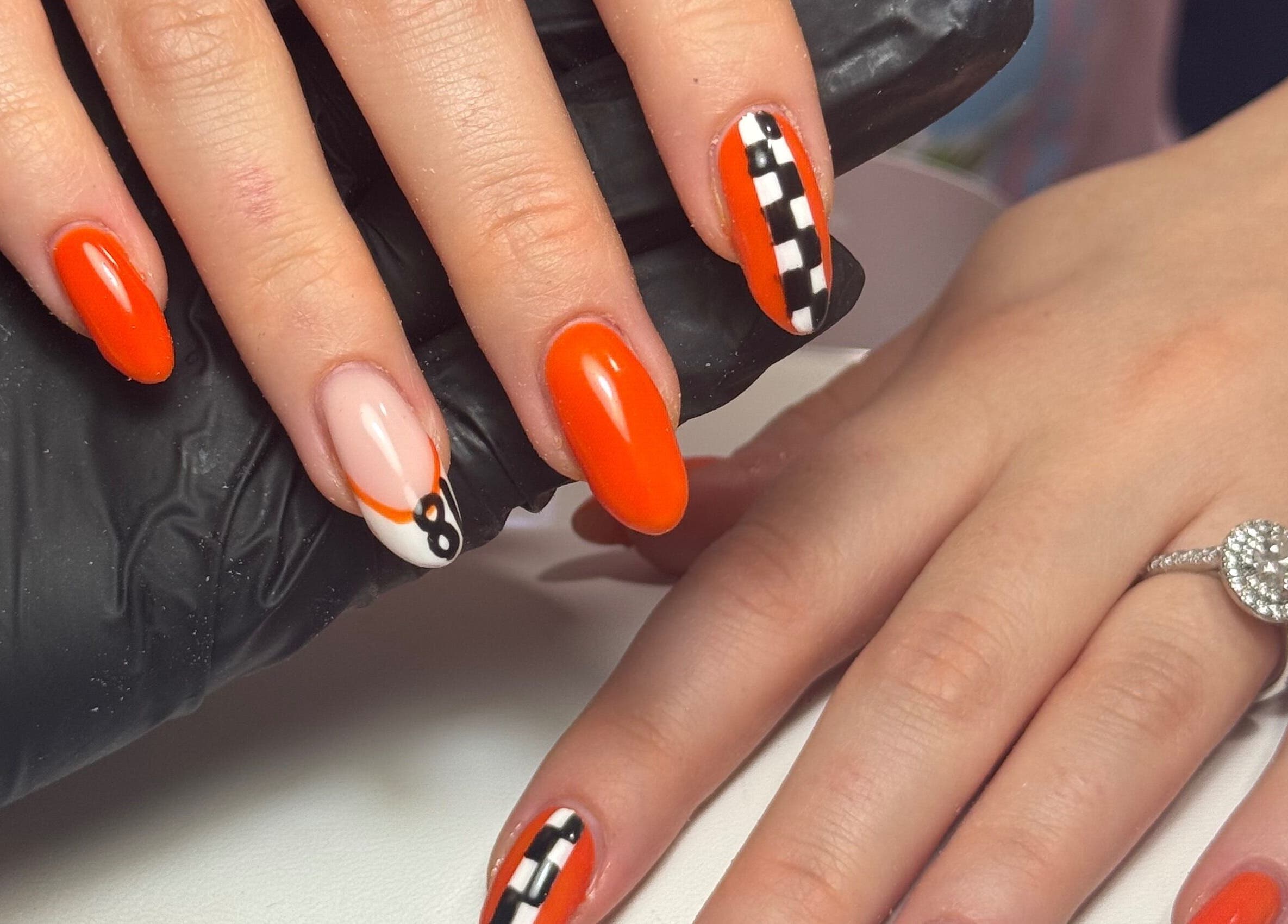 Bright orange nail art at Nails by Lulu, Fareham, England, GB. Perfect for adding glamour to any occasion.