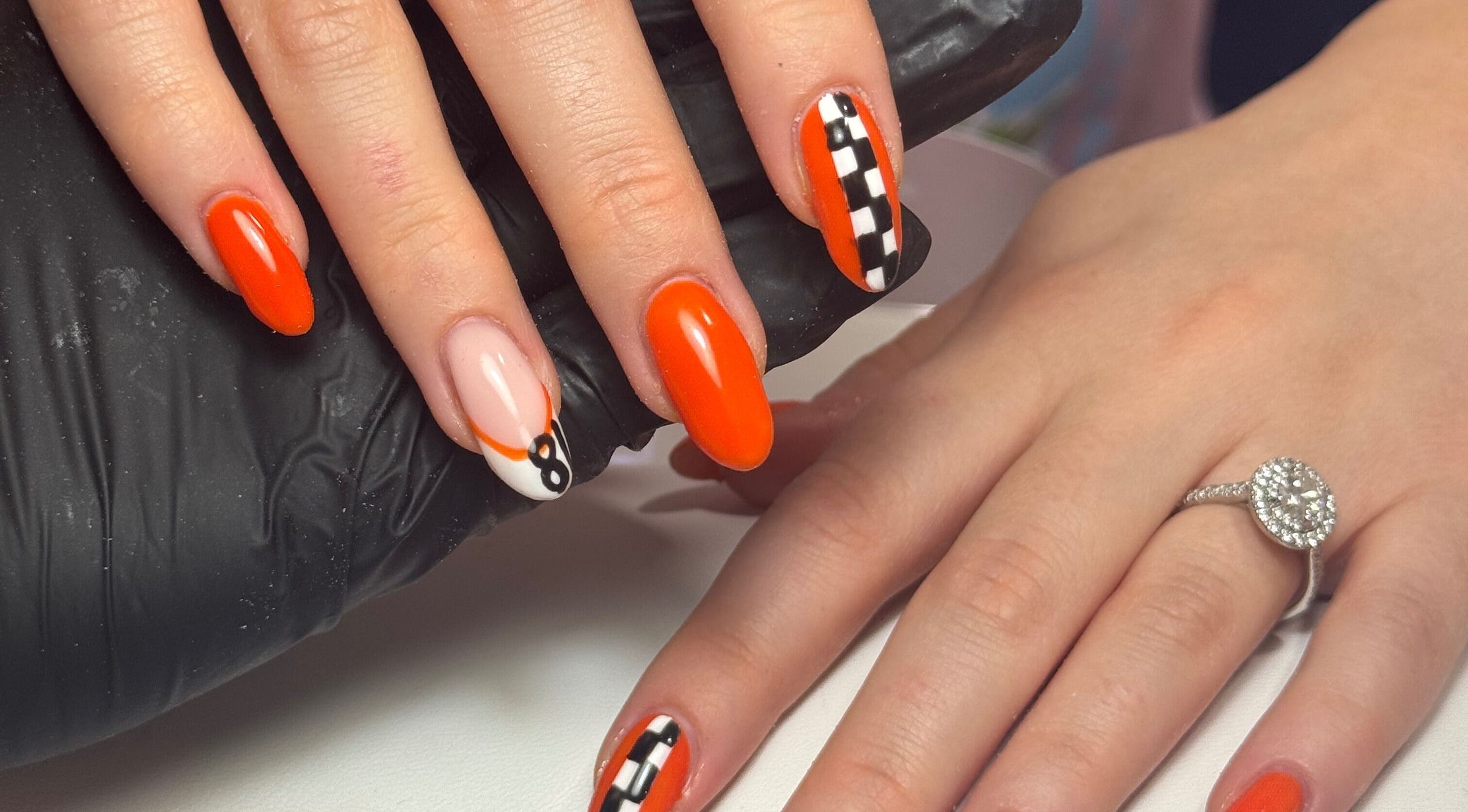 Bright orange nail art at Nails by Lulu, Fareham, England, GB. Perfect for adding glamour to any occasion.
