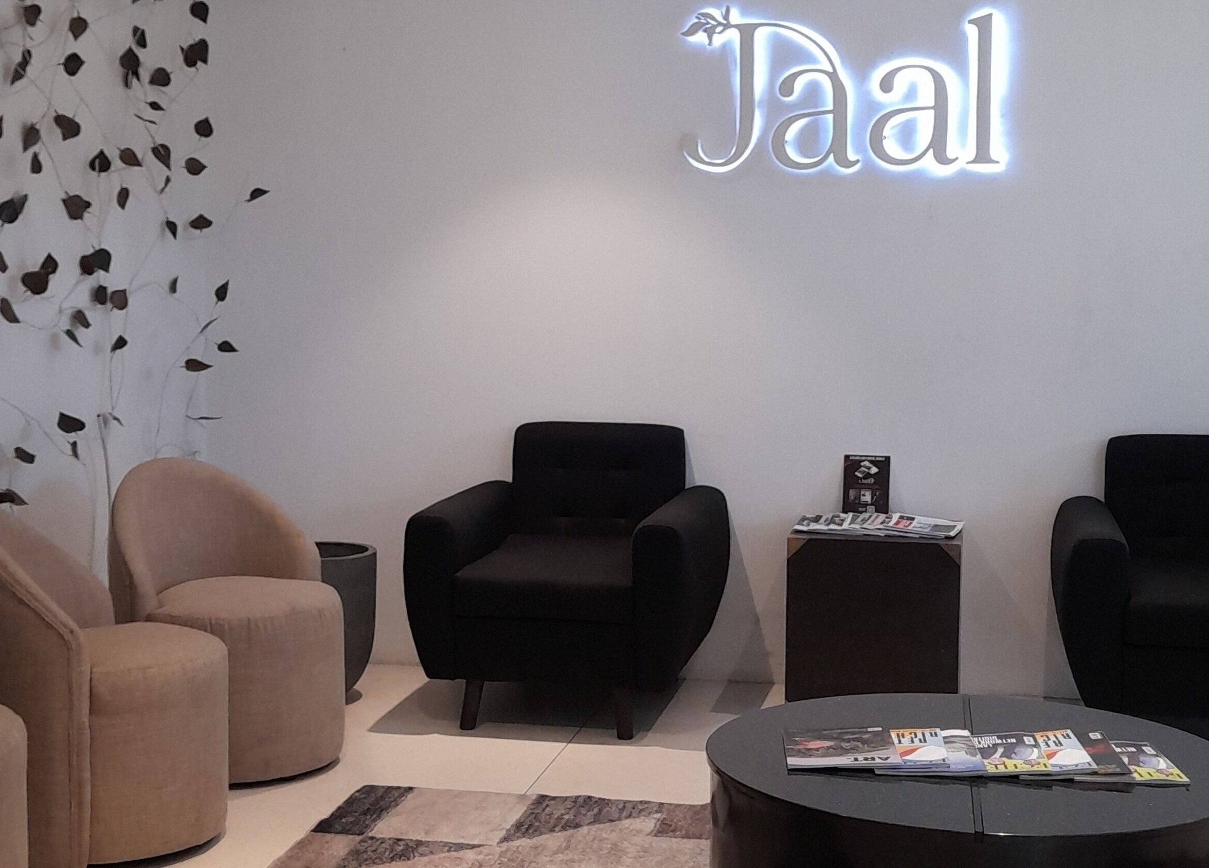 Elegant waiting area at Jaal Salon, Colombo, Western Province, LK, featuring modern chairs and decor.
