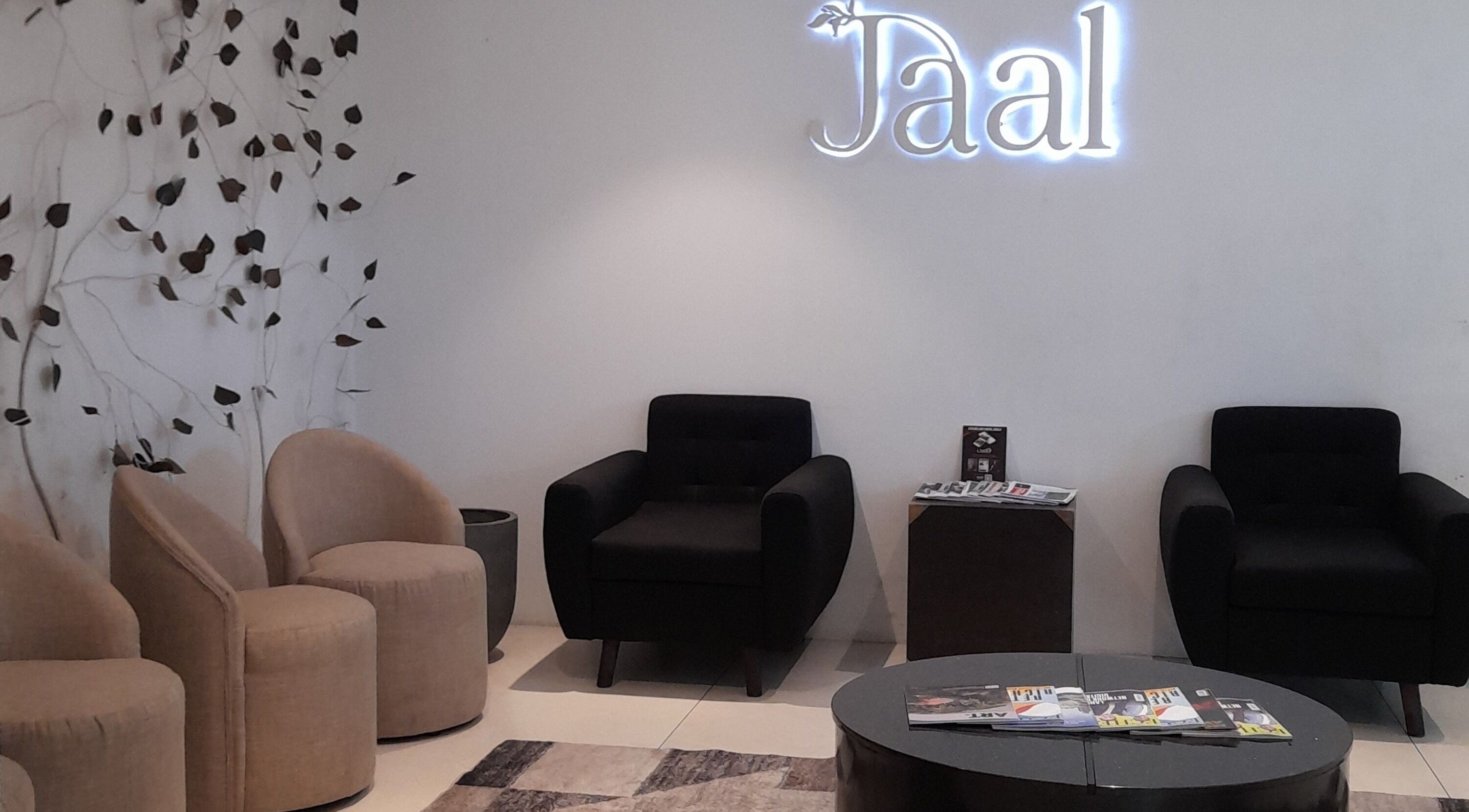 Elegant waiting area at Jaal Salon, Colombo, Western Province, LK, featuring modern chairs and decor.
