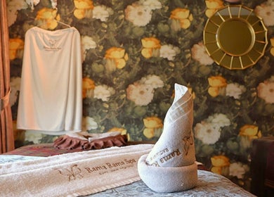 Peaceful spa room at Rama Rama Spa, Kota Kinabalu, Sabah, MY with floral decor and cozy towels.