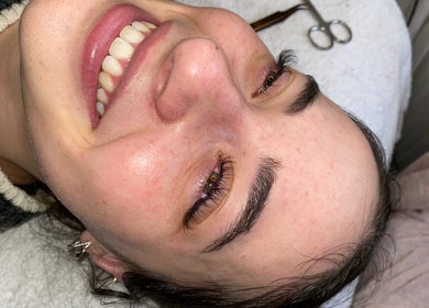 Client enjoys facial treatment at Raineydays Aesthetic Salon, Alberton, Gauteng, ZA, feeling relaxed and pampered.