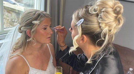 A makeup artist applies makeup to a bride at Beauty by Anna May, Burnley, England, GB.
