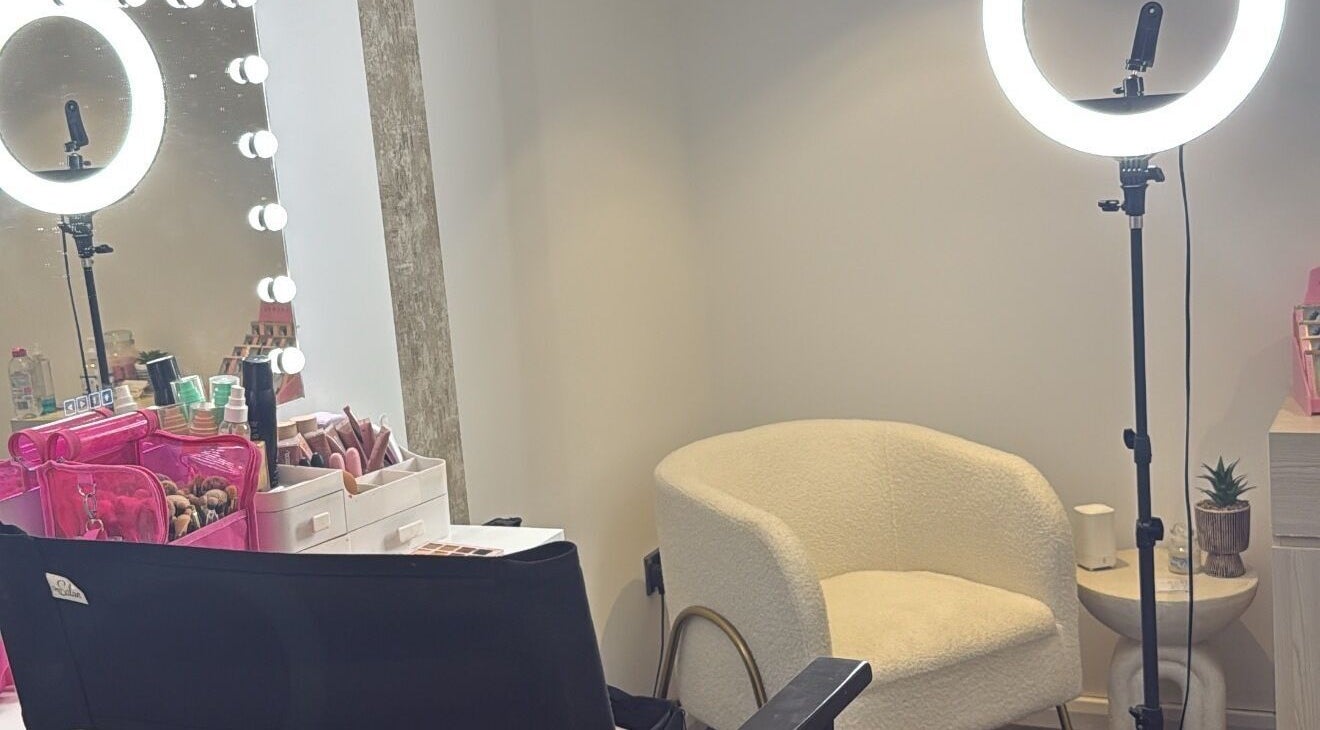 Beauty by Anna May salon interior in Burnley, England, featuring a makeup station with chairs and lighting.