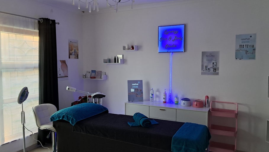 Tranquil treatment room at Synergy Skin And Body Studio in Cape Town, Western Cape, ZA, showcasing a massage table.