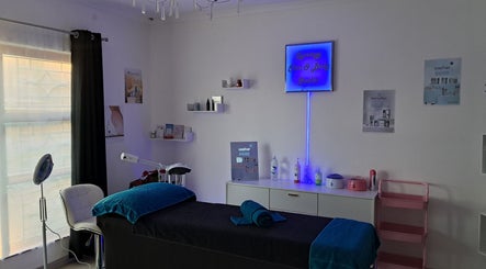 Tranquil treatment room at Synergy Skin And Body Studio in Cape Town, Western Cape, ZA, showcasing a massage table.