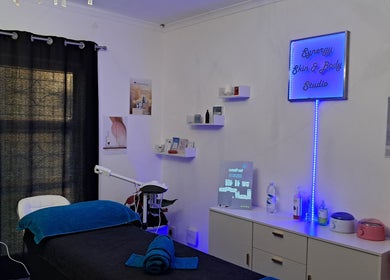 Synergy Skin And Body Studio treatment room in Cape Town, Western Cape, ZA featuring elegant decor and equipment.